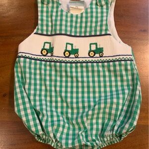 Green Checkered Kids Romper with smocked front and tractors. Covered buttons.